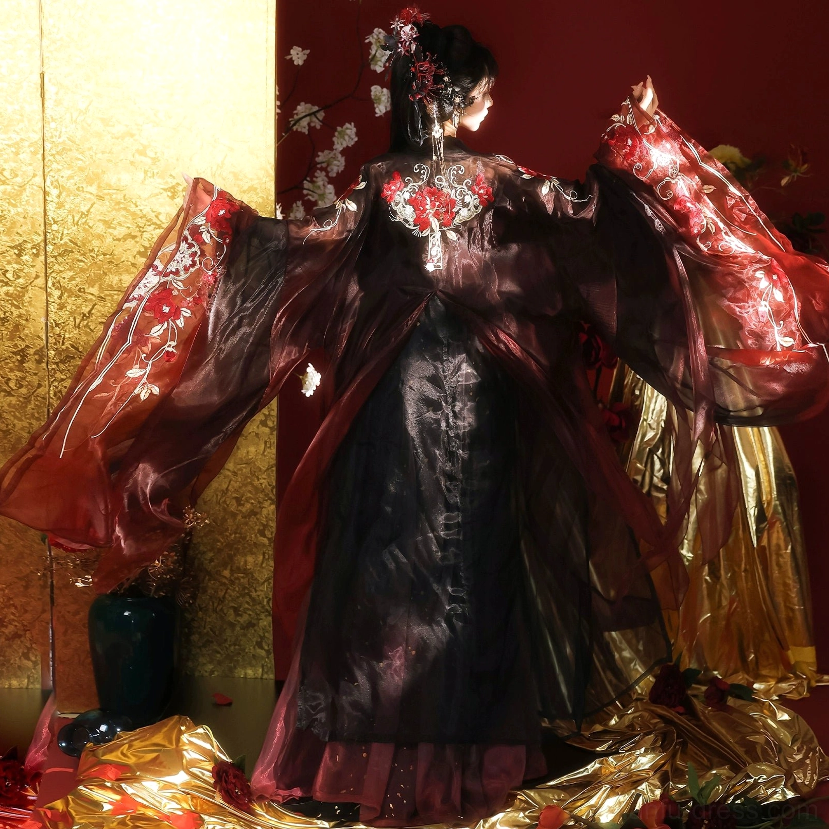 Full back view of Tang Dynasty Qixiong Ruqun Hanfu showing detailed floral embroidery, wide flowing wine red sleeves, and a long gold-speckled black skirt