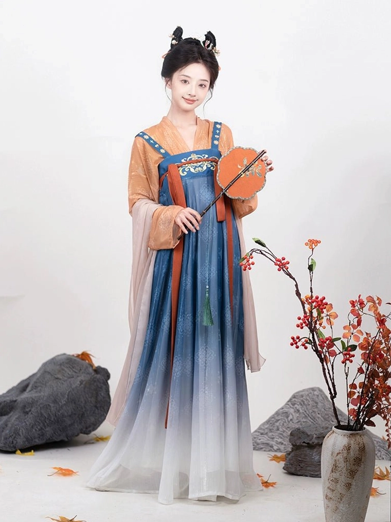 Front view of Tang Dynasty Qixiong Ruqun Hanfu in orange and blue with gradient skirt embroidered chest details and sheer pink shawl