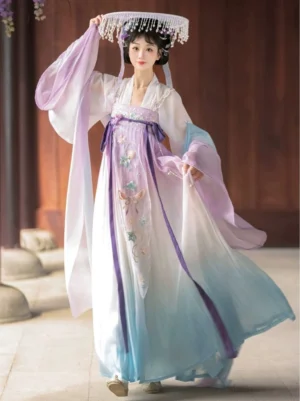 Front three quarter view of a Tang Dynasty Qixiong Ruqun Hanfu in purple white and cyan ombre with floral bodice detailing wide sleeves purple waist ribbons and traditional Chinese courtyard styling