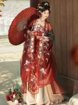 Three-quarter view of a traditional Tang Dynasty Hanfu Qixiong Ruqun outfit with floral embroidery, flowing sheer cape, wide sleeves, and red vintage Chinese paper umbrella