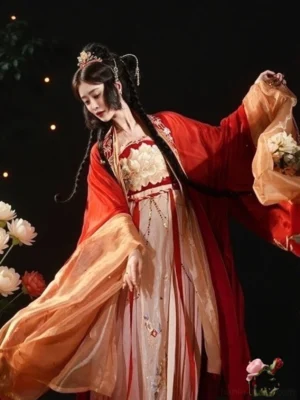 Tang Dynasty wedding hanfu in motion showing flowing translucent sleeves, crimson embroidered outer coat, and layered champagne pink bridal dress
