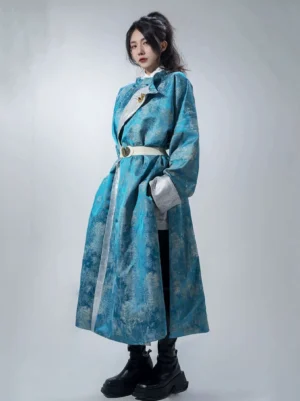 Full body front view of a blue Tang Dynasty style reversible hanfu coat with jacquard fabric, silver trim, white waist belt, stand collar, and long flowing hem