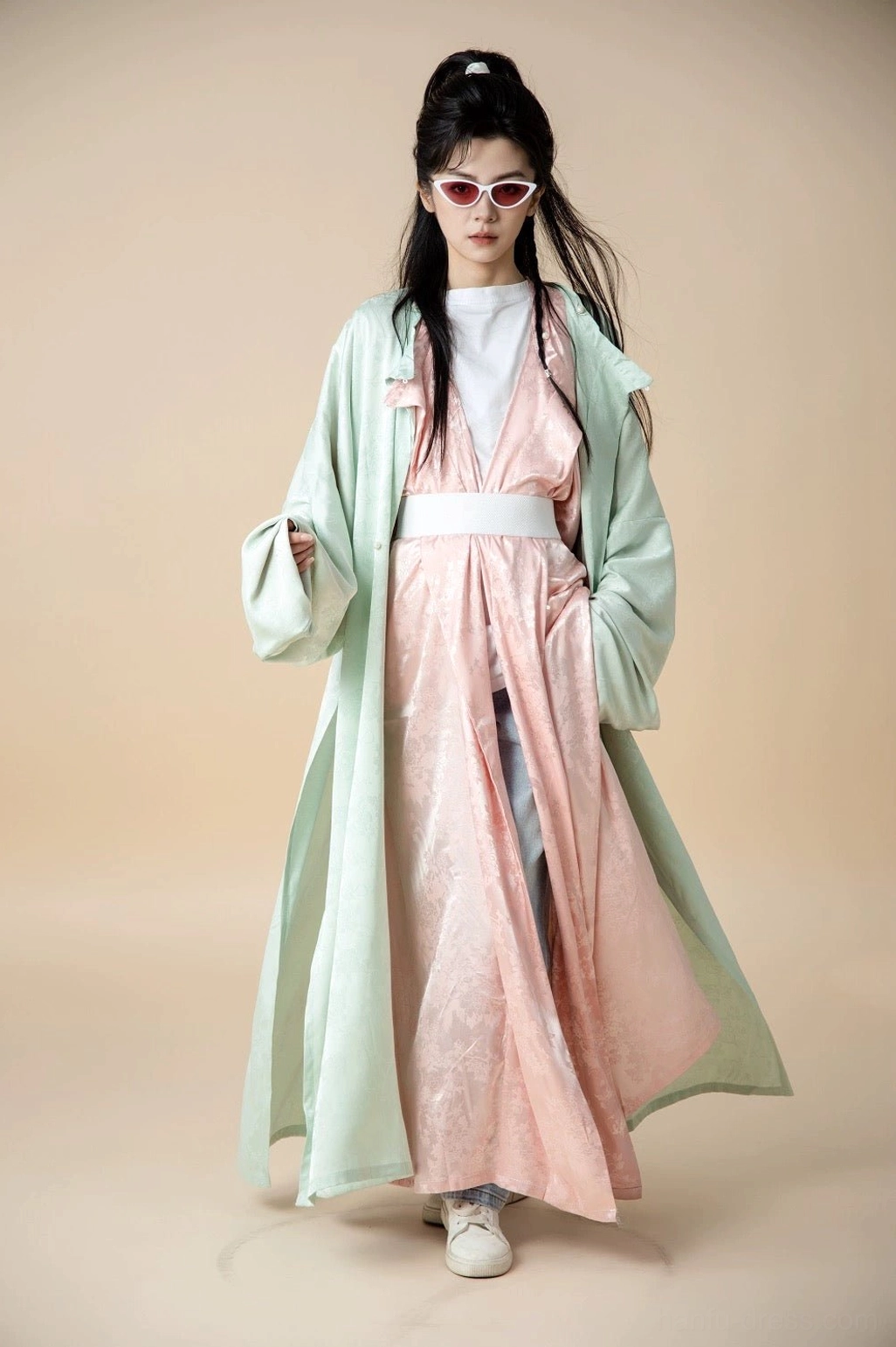 Mint green Tang Dynasty inspired round-neck Hanfu robe styled over a pink jacquard dress in a full-length studio front view