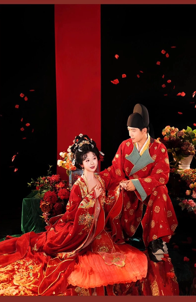 Bride and groom wearing coordinated Tang Dynasty wedding Hanfu in a romantic ceremonial pose, with scarlet bridal gown, golden embroidery, and traditional styling