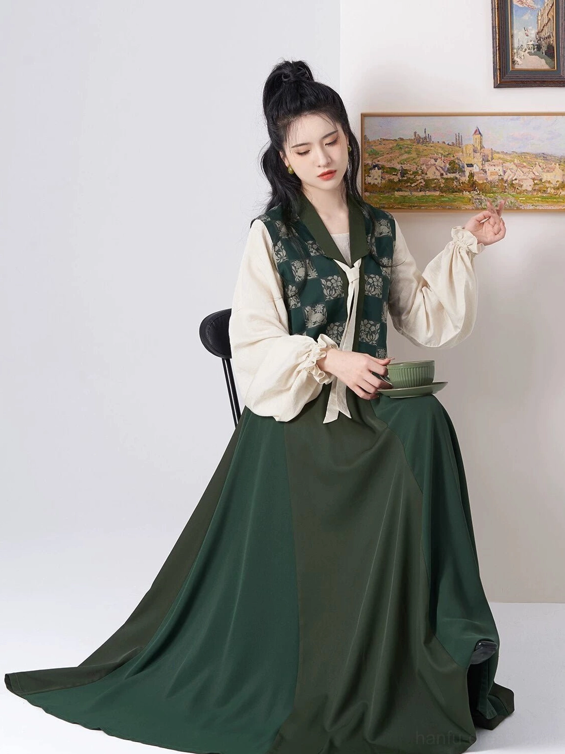 Seated view of an elegant Tang inspired Hanfu outfit with graceful dark green skirt drape and floral jacquard Beizi overlay