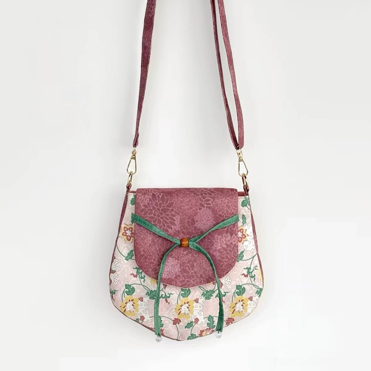 Tang-inspired spring garden floral Chinese crossbody bag with mauve flap green ribbon bow and matching shoulder strap front view