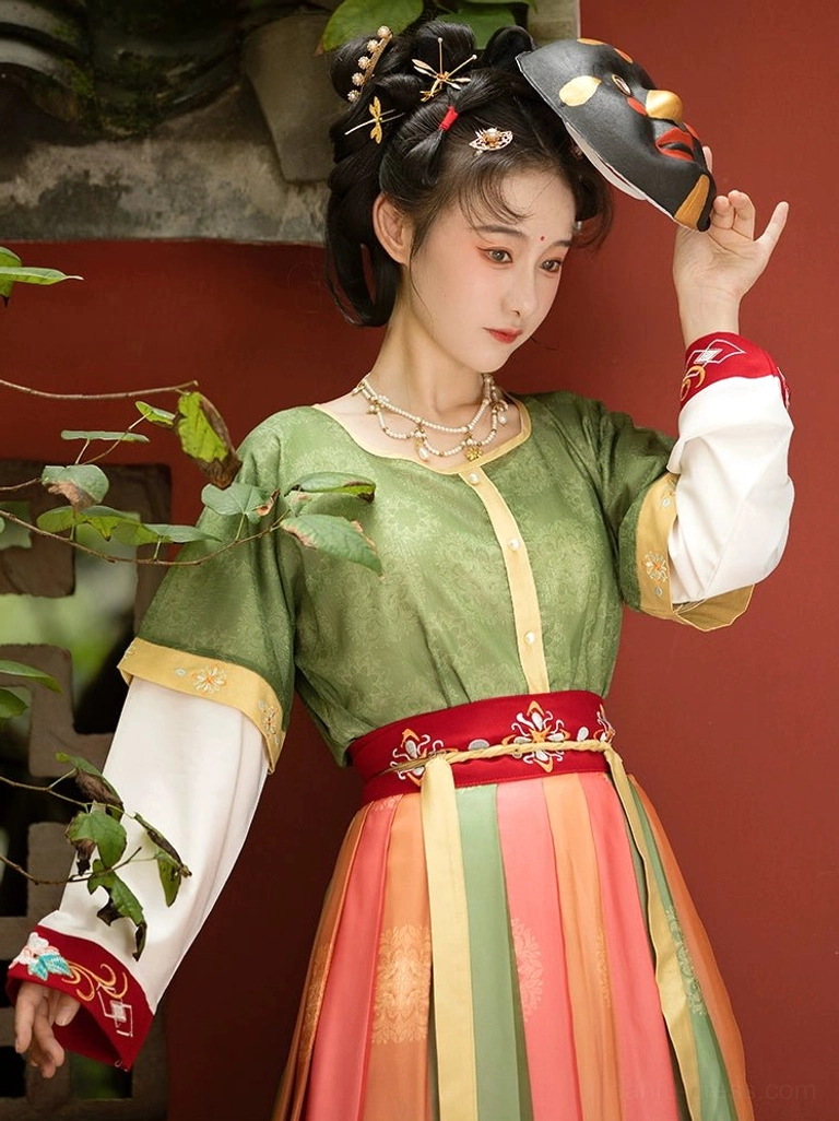 Close-up of Tang style Hanfu green textured U-collar top and red embroidered waist sash with layered white sleeves