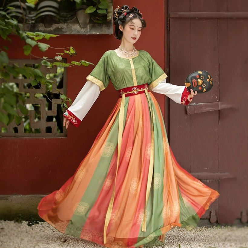 Back three-quarter view of Tang style U-collar Qiyao Ruqun Hanfu with dramatic flowing multicolor skirt and red sash