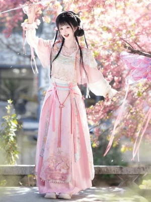 Full body front view of Taoyao sweet pink xianxia hanfu set with embroidered skirt hem, pearl trim, tassel sash and long ribbons