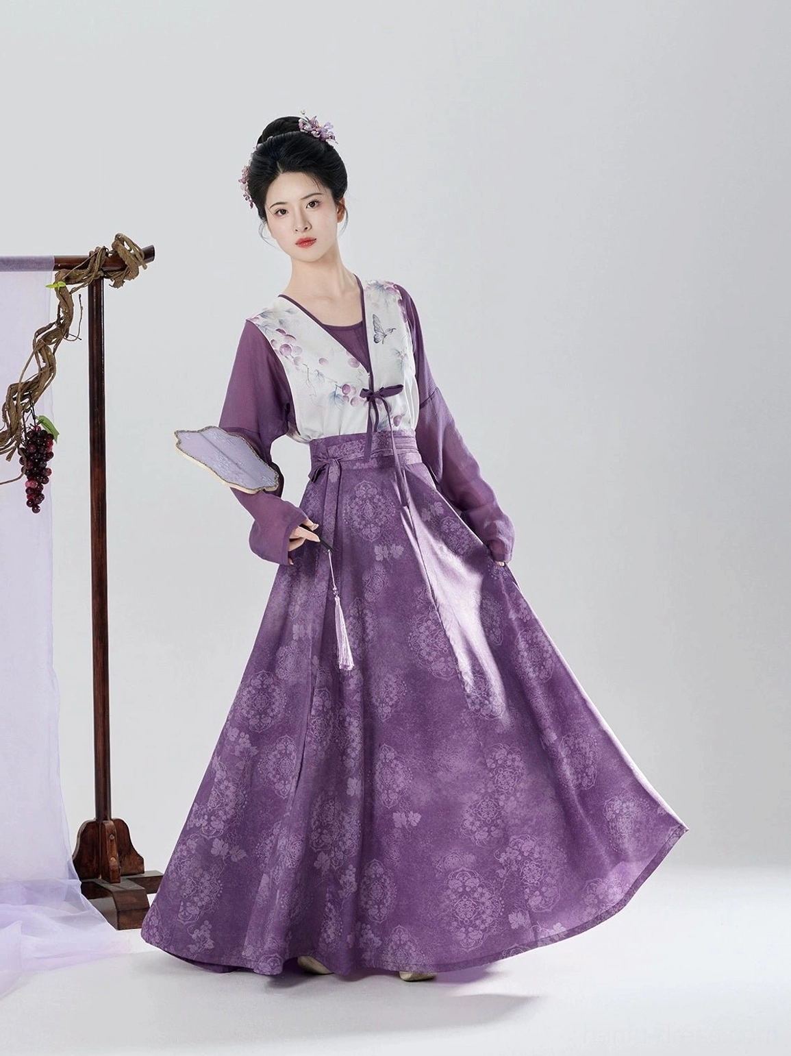 Three-quarter view of purple Tang Dynasty hanfu outfit with printed beizi overlay and elegant full-length eight-panel skirt