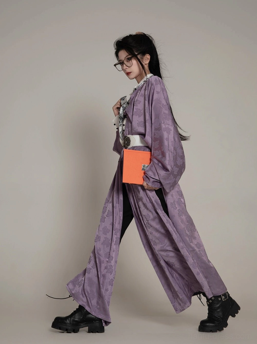 Full-length side view of a modern taro purple Hanfu robe styled with wide-leg trousers, white waist belt, glasses, and black combat boots