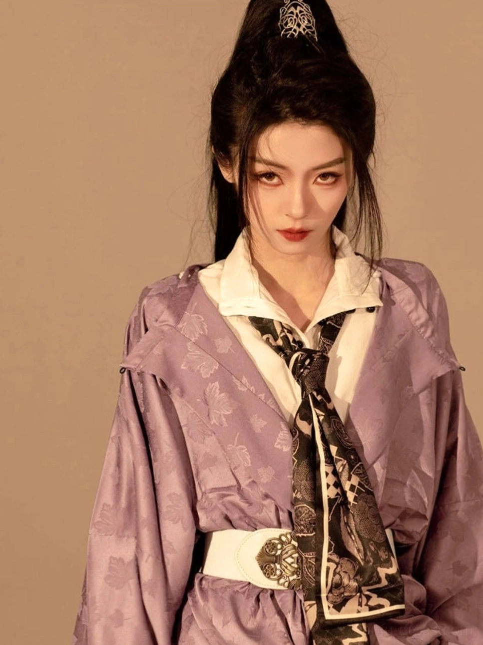Upper-body close-up of a taro purple round-neck Hanfu robe showing woven jacquard fabric, printed neck scarf, and ornate white waist belt