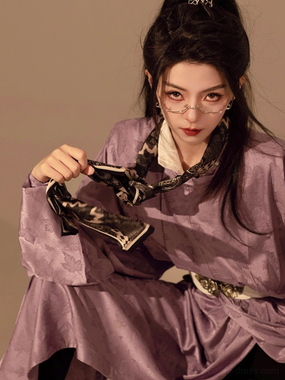 Close-up styling image of a taro purple Tang Dynasty Hanfu robe with jacquard woven fabric, printed silk scarf, and decorative white belt