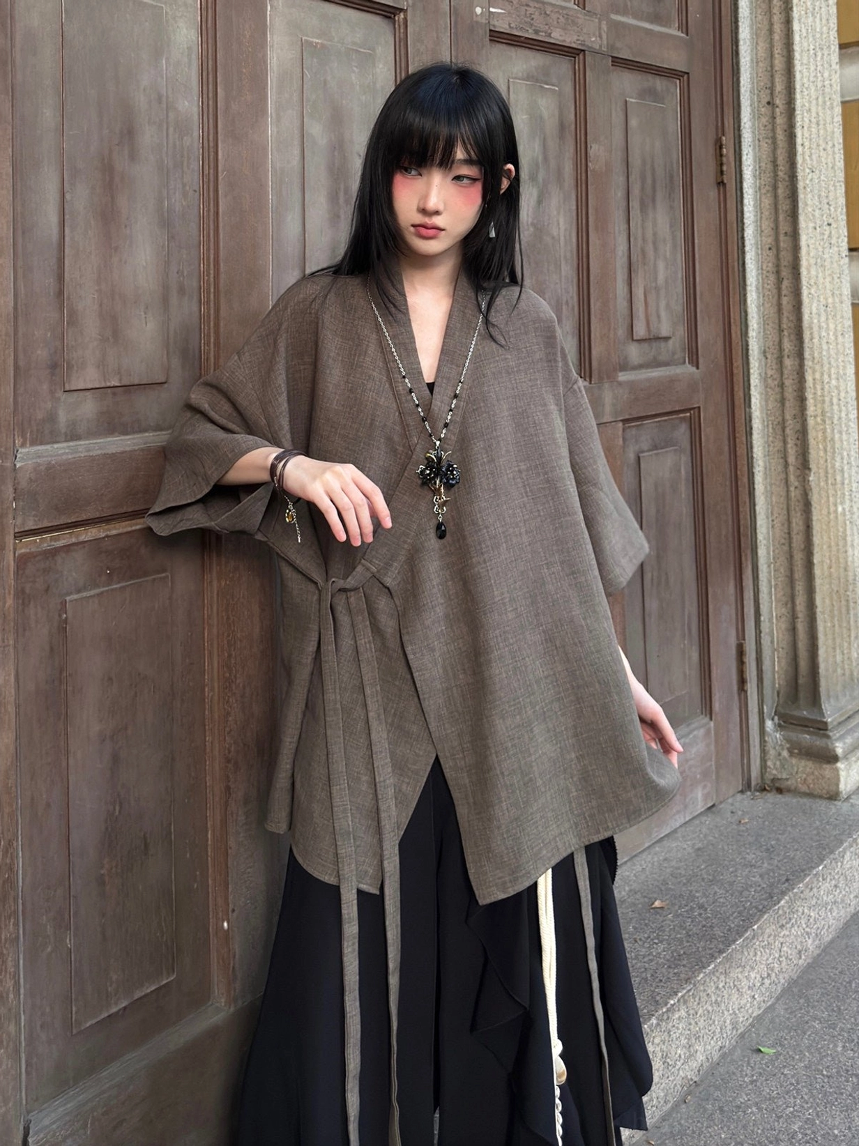 Taupe brown modern Hanfu cardigan with cross V-neck, linen-like textured fabric, side wrap ties, and relaxed casual fit