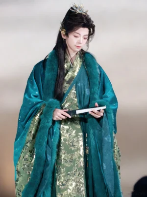 Teal Song Dynasty inspired men’s cross-collar Hanfu coat with gold speckles, gold patterned inner robe, plush collar trim, and folding fan