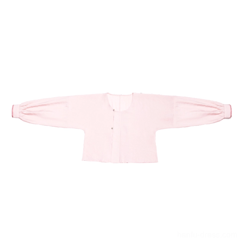 Blush pink Tang Dynasty Hanfu round collar top with lantern sleeves and small green decorative button closure flat lay