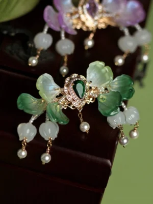 Green Tinglan Chinese flower tassel back hair pin with gradient glass petals, dark green centerpiece, gold-tone frame, and pearl-like dangling ornaments