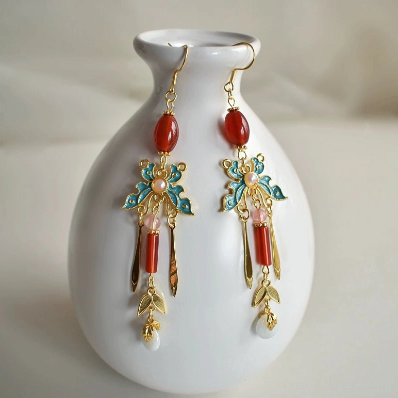 Traditional Chinese style tassel drop earrings with butterfly motifs red beads pearl-like pendants and gold tone chains