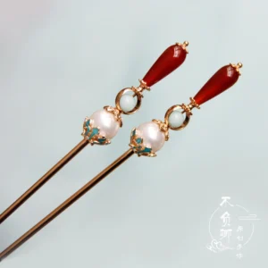 Traditional Chinese hairpin pair in gold tone with pearl turquoise floral ornament and dangling red teardrop beads for Hanfu hairstyle