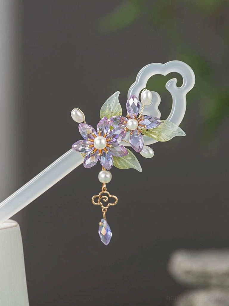Traditional Chinese hair stick with complete purple crystal floral decoration, pearl accents, green leaves, matching cloud-shaped end, and elegant hanging charm
