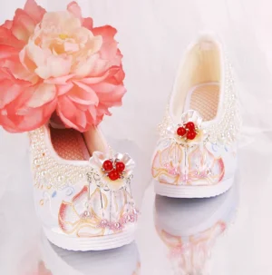 Traditional Chinese Hanfu shoes with lotus embroidery, pearl embellished sides, breathable woven insole, and red floral bead tassels