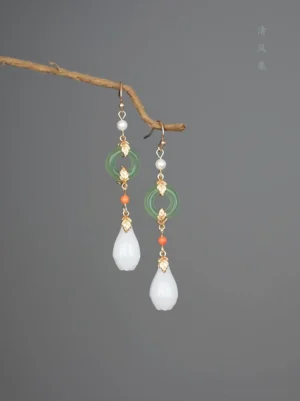 Traditional Chinese magnolia drop earrings for Hanfu with green jade style rings white flower pendants pearls and delicate gold tone details