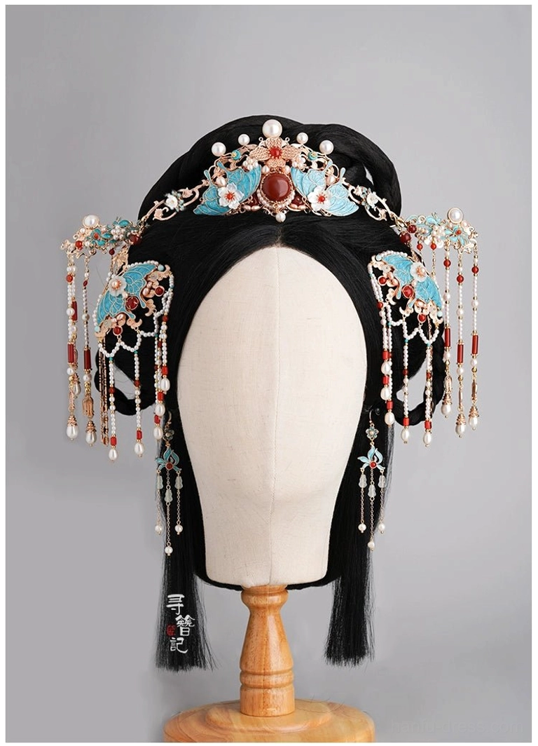 Traditional Chinese wedding-inspired hair accessory arrangement on an ancient-style wig mannequin featuring blue, red, gold, pearl ornaments, and long decorative tassels