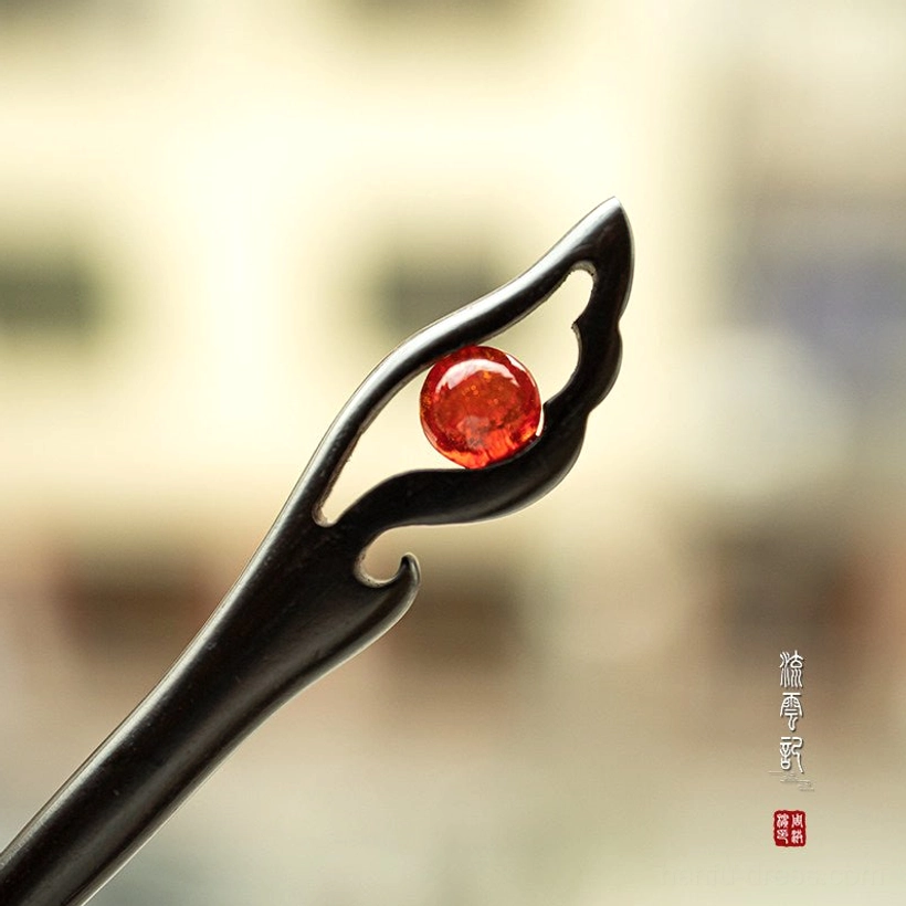 Red crackle glass traditional Chinese wooden hair stick with black carved wing-shaped setting