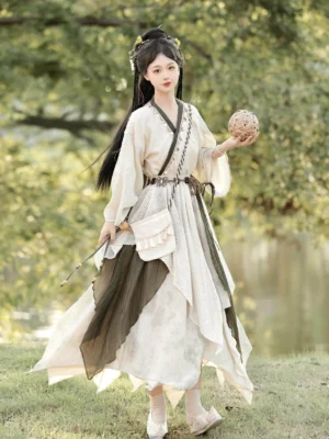 Traditional Chinese xianxia hanfu costume front view showing cross-collar top layered asymmetrical skirt woven waist styling and natural earth-tone colors