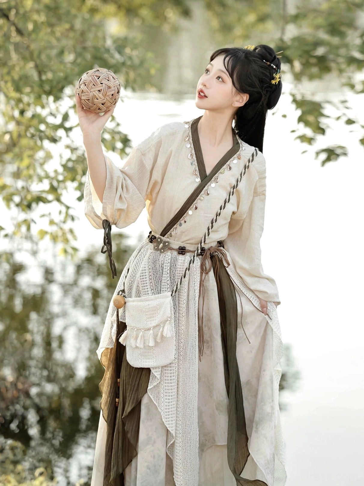 Side and back view of Travelling Lotus modern Hanfu set with olive trimmed asymmetrical layered skirt and relaxed New Chinese Style silhouette