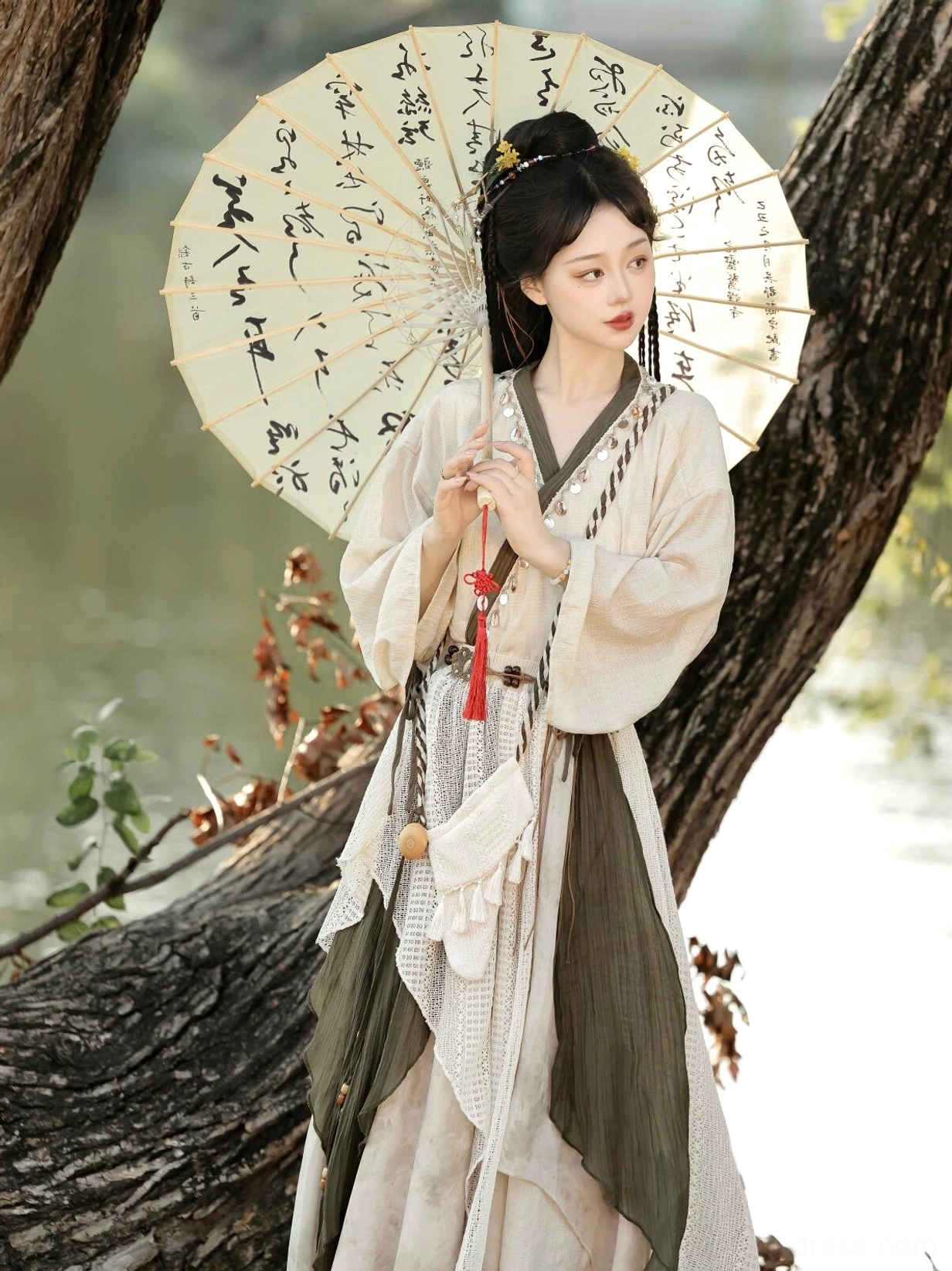 Front view of Travelling Lotus modern Hanfu complete set featuring beige fabric, olive green color blocking, and irregular layered skirt hem
