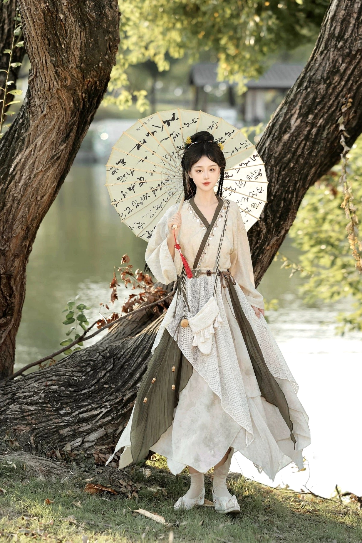 Travelling Lotus New Chinese Style Hanfu set with beige cross-collar top, dark green trim, layered skirt, and traveler-inspired waist styling
