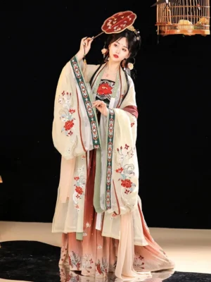 Full-length front view of a woman wearing a Twilight Tang Dynasty Hanfu dress with beige embroidered wide sleeves, light green inner garment, gradient skirt, traditional hair accessories, and round silk fan