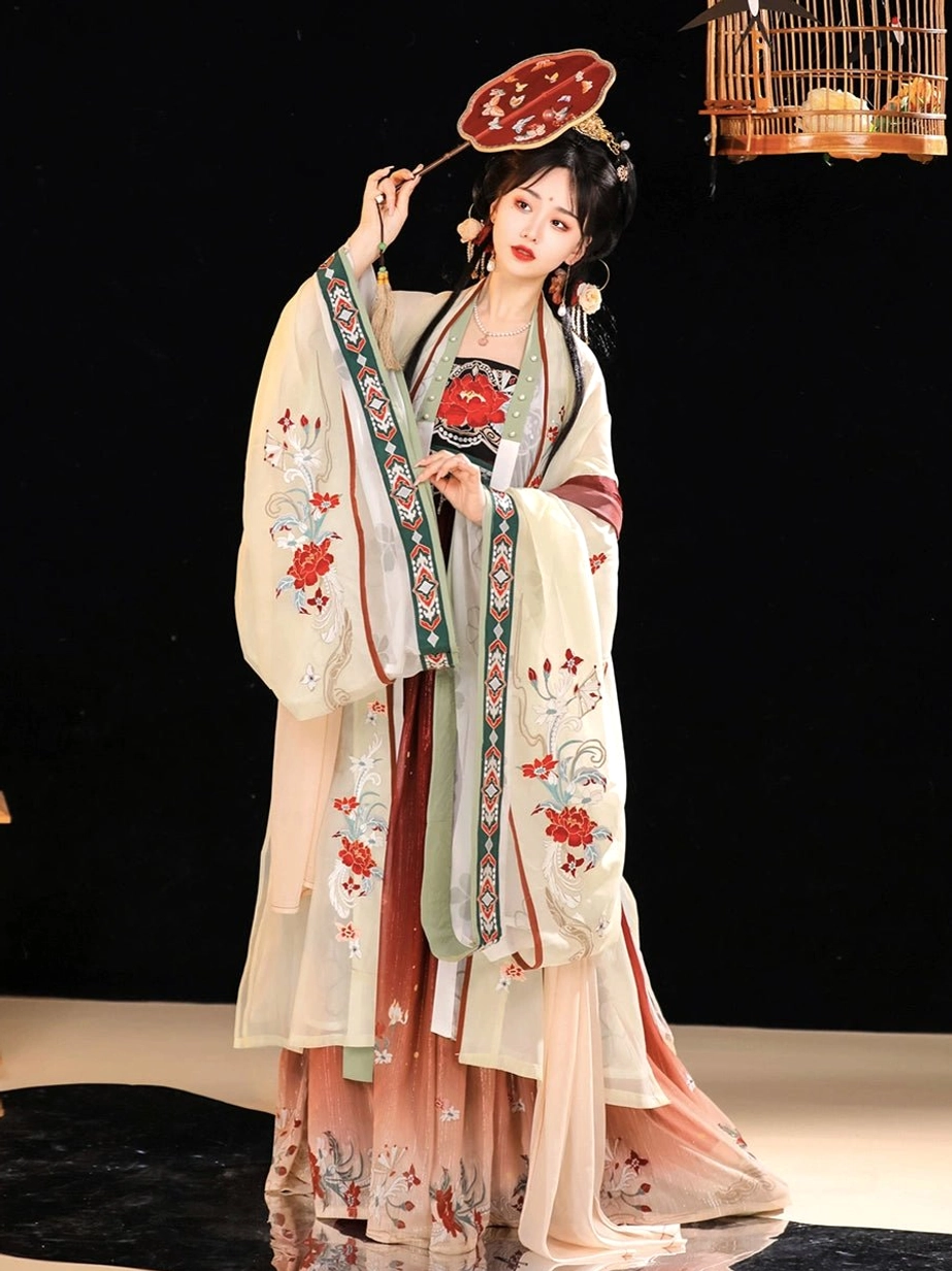 Full-length front view of a woman wearing a Twilight Tang Dynasty Hanfu dress with beige embroidered wide sleeves, light green inner garment, gradient skirt, traditional hair accessories, and round silk fan