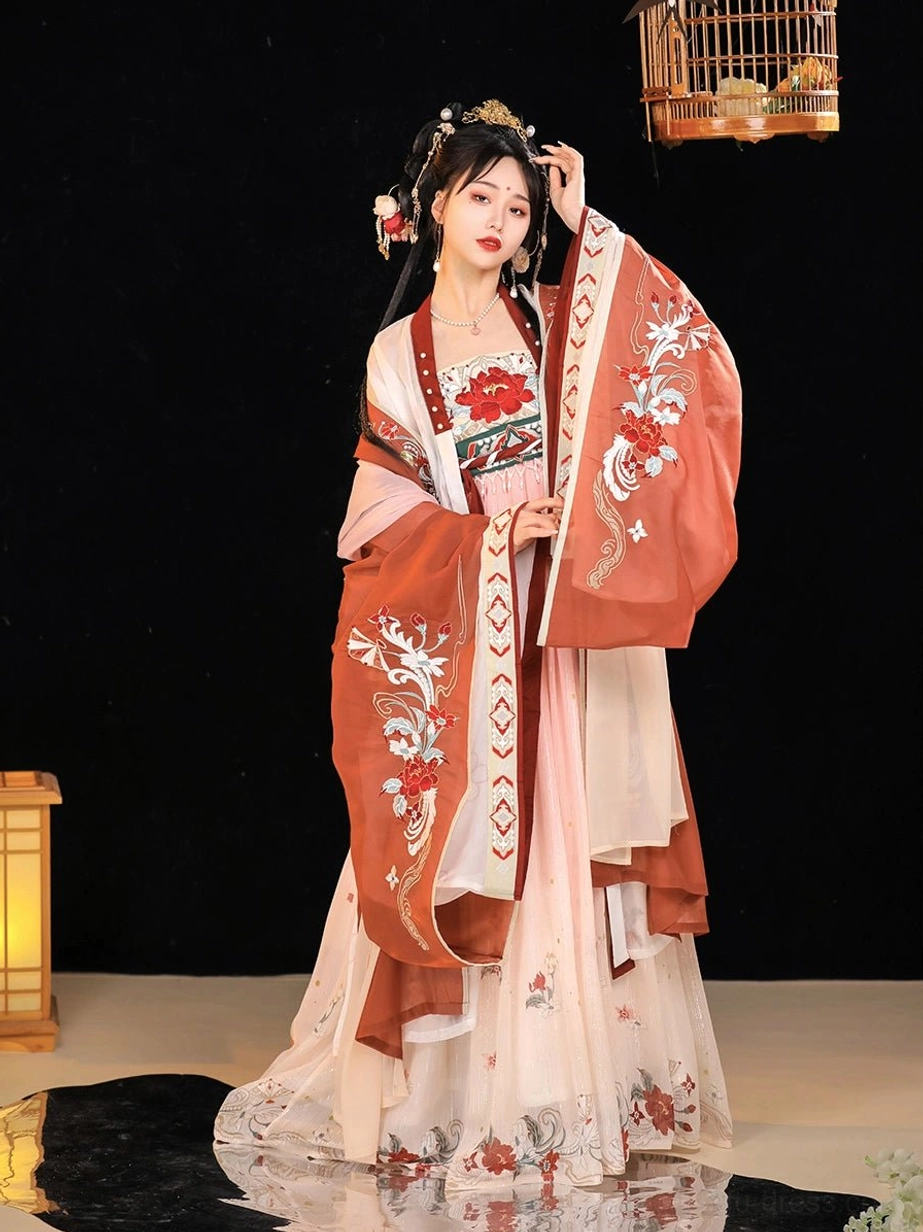 Side view of the reddish-brown Twilight Tang Dynasty Hanfu coat paired with an ivory gradient skirt, embroidered chest panel, wide sleeves, and traditional Chinese hairstyle
