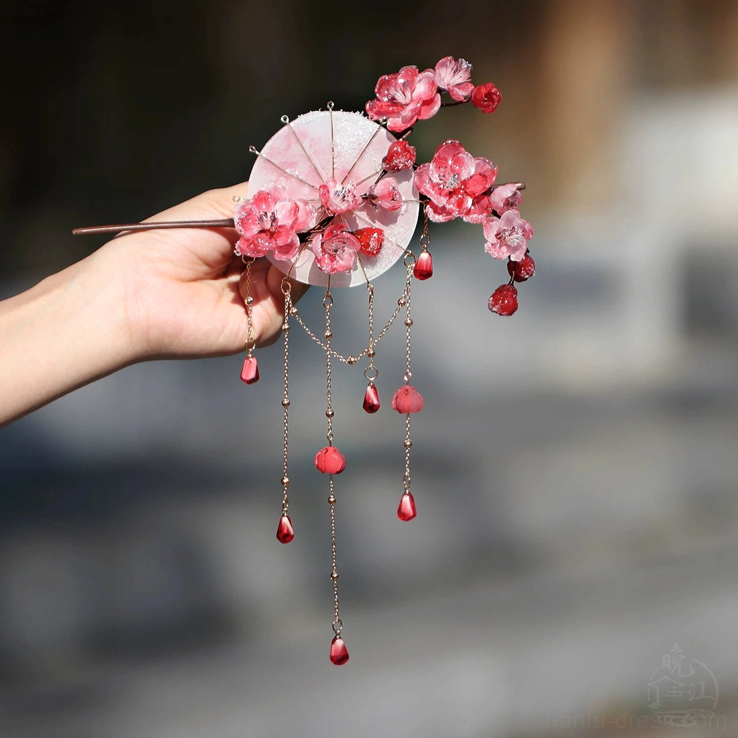 Complete two piece plum blossom Chinese hair stick set with umbrella motif tassels and red floral ornaments