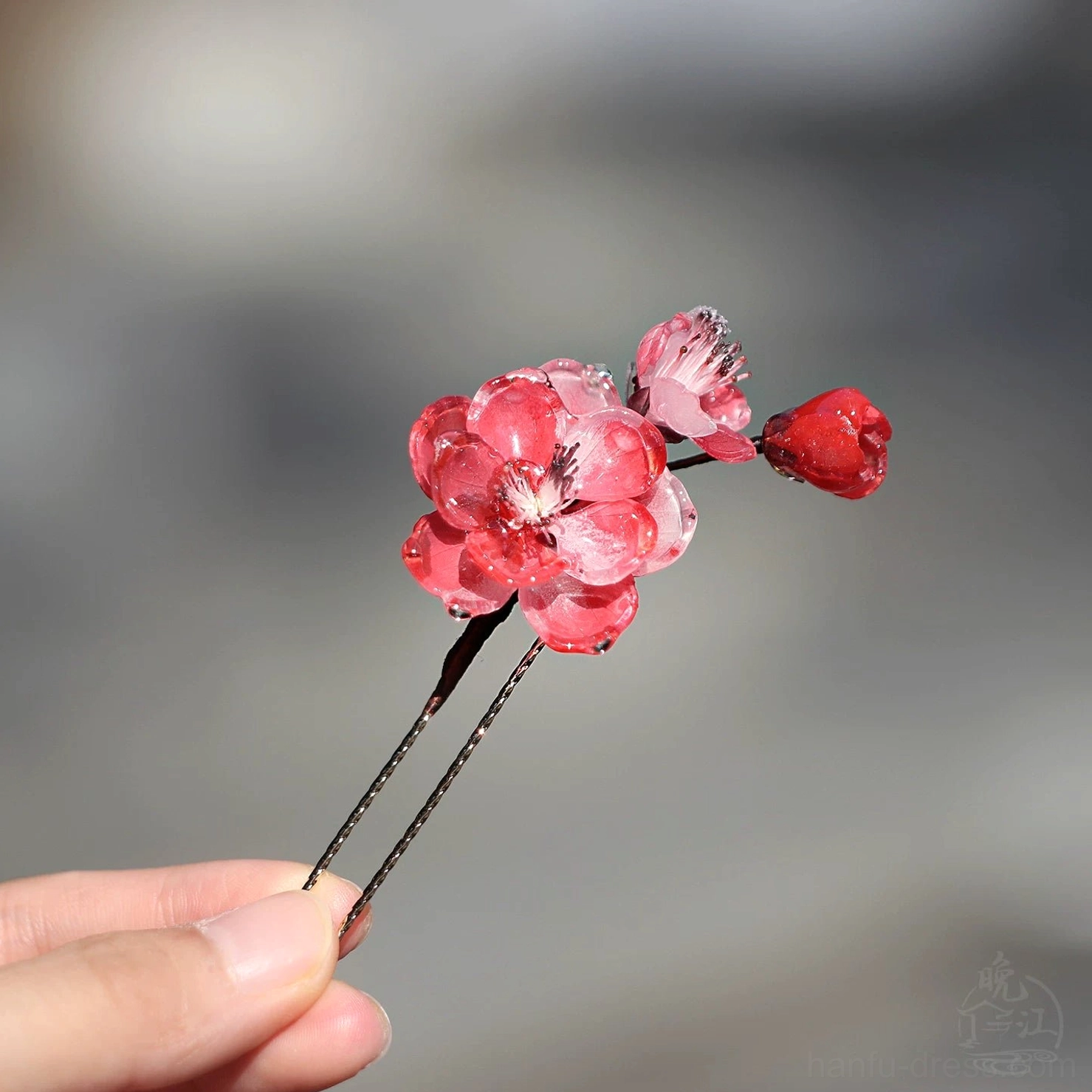 U shaped double prong Chinese hairpin with pink red plum blossom flowers and antique bronze toned metal details