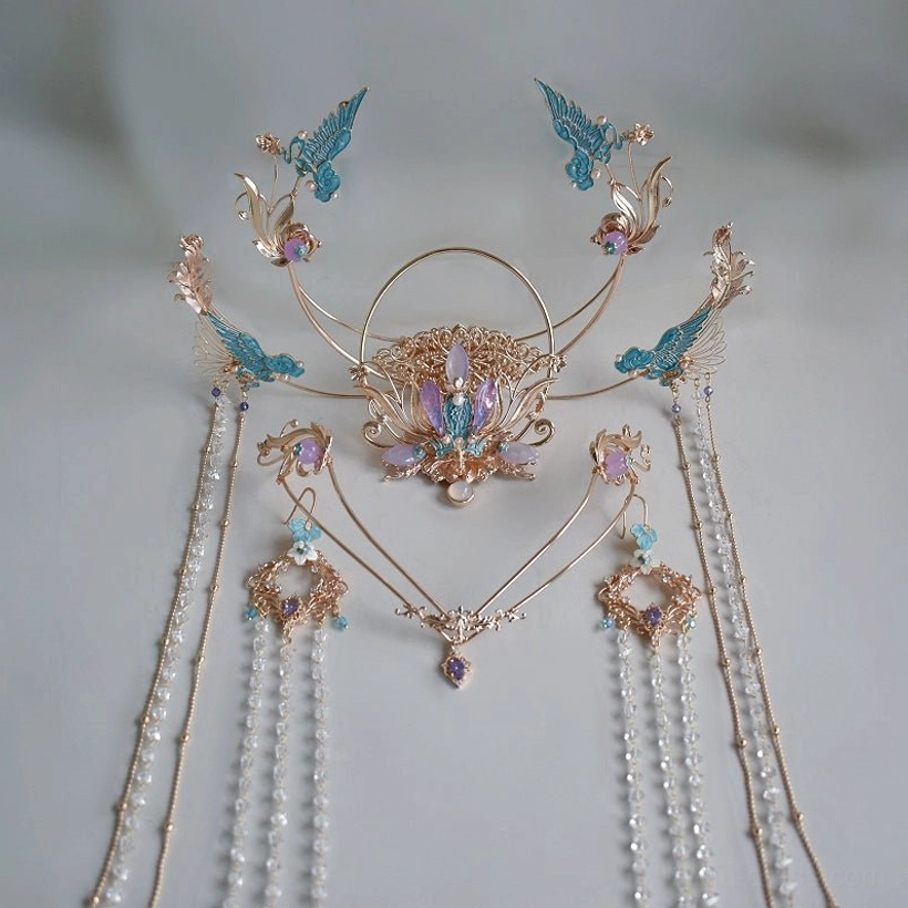 Unassembled complete purple Dunhuang Hanfu hair accessory set displayed on a studio background, including gold-tone crown pieces, blue bird ornaments, layered chains, crystal beads, and detachable tassels