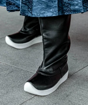 Unisex black Hanfu boots worn with blue cloud pattern Hanfu skirt, featuring traditional upturned toe and white platform sole