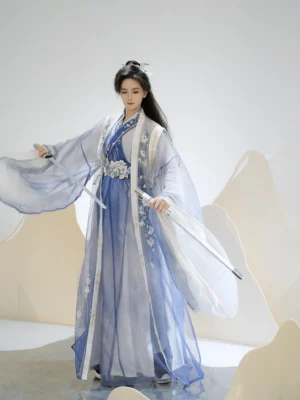 Unisex Xianxia hanfu costume with layered robes floral embroidered trim and blue gradient fabric styled with traditional Chinese swords
