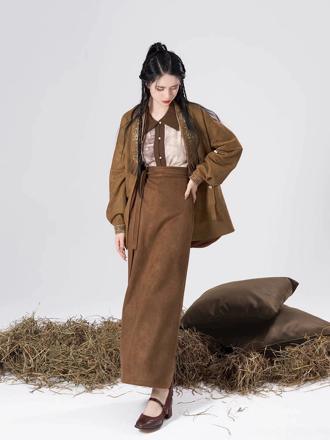 Side front view of an Urban Nomad inspired Song style Hanfu set with a loose brown coat, full-length skirt, and tonal inner shirt
