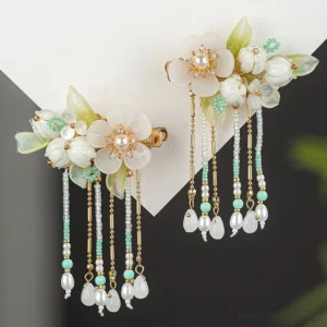 Pair of long tassel Hanfu side hair clips with white resin flowers green leaves multi-strand bead chains and pearl-style pendant ornaments