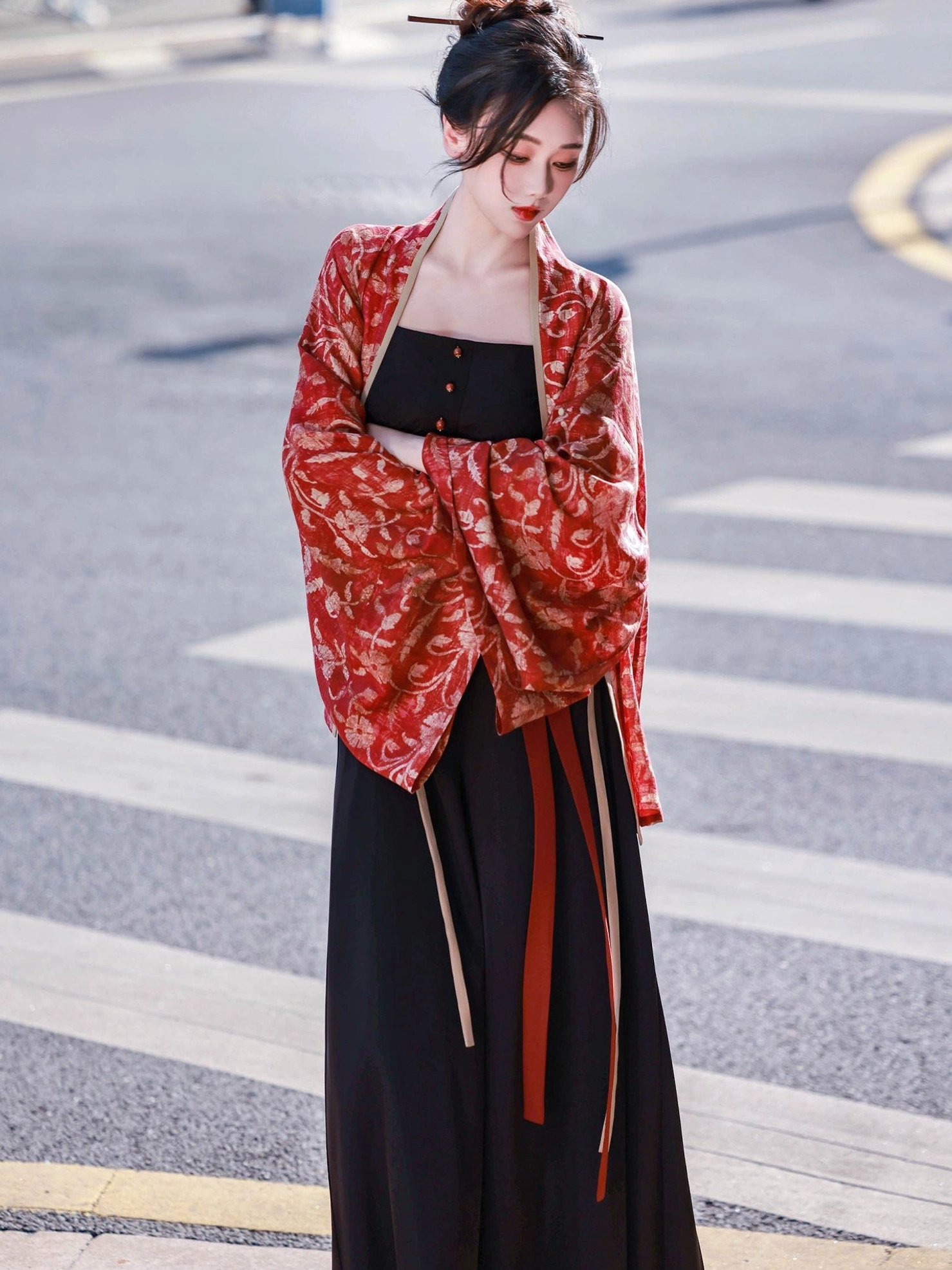 Modern Chinese style Vermilion Bird Song-style Hanfu outfit with red printed cardigan black camisole and wide-leg trousers worn on an urban street