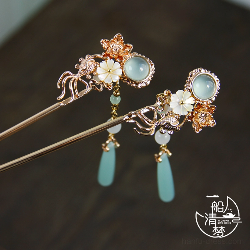 Vintage inspired Chinese hair accessories with pale blue jade style accents, shell flower petals, and delicate dangling pendants