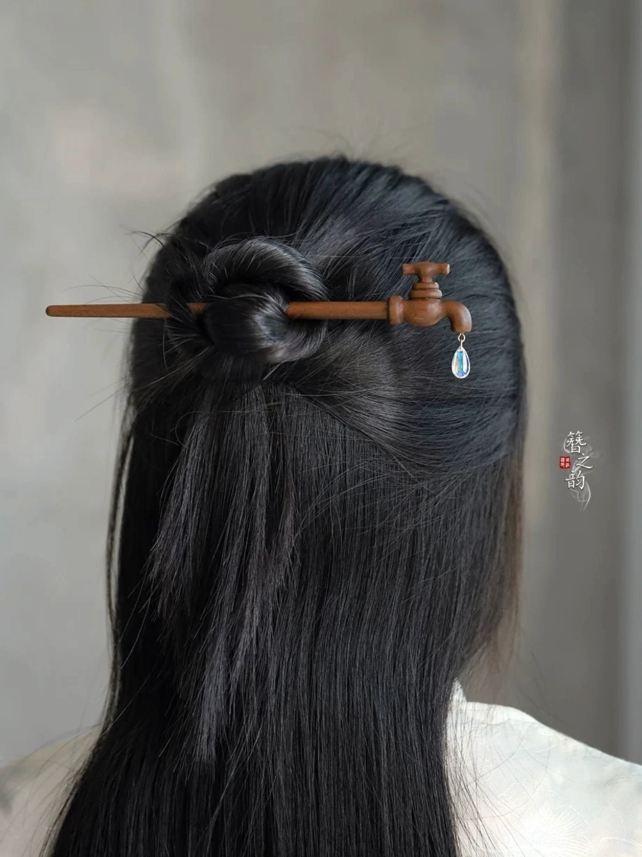 Vintage faucet wooden Chinese hair stick worn in a long half-up hairstyle with clear teardrop crystal pendant