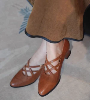 Tan brown vintage crisscross Mary Jane block heels worn with a brown retro skirt, side back view of pointed toe Qipao and Hanfu shoes