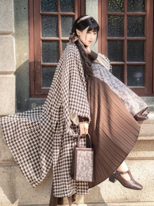Warm Autumn Song Dynasty Hanfu outfit with brown houndstooth beizi jacket and pleated wrap skirt shown in a low three-quarter view