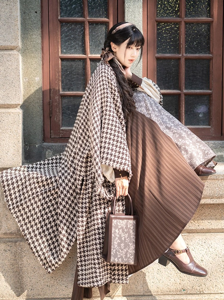 Warm Autumn Song Dynasty Hanfu outfit with brown houndstooth beizi jacket and pleated wrap skirt shown in a low three-quarter view