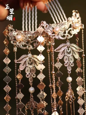 Warm antique gold tone Chinese style hair pins with ornate filigree leaf motifs, beads and long hanging tassels
