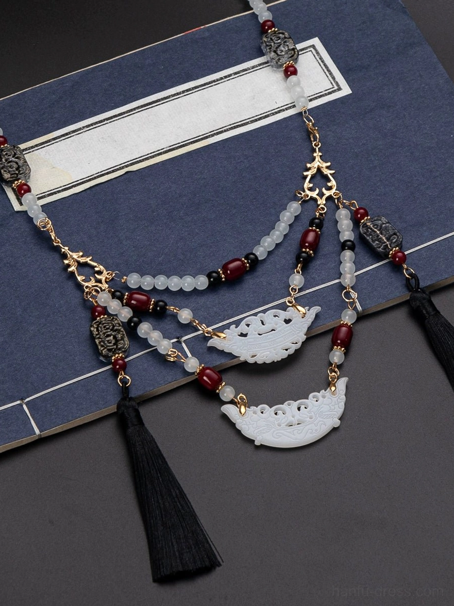 Close detail of Warring States inspired Chinese necklace with gold tone connectors mixed bead strands and layered ornamental chain design